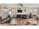 Bright living room with natural light, hardwood flooring, and modern decor at 2672 Painted Mist Ct, Las Vegas, NV 89142