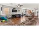 Spacious living room with hardwood floors, neutral walls, and comfortable seating at 2672 Painted Mist Ct, Las Vegas, NV 89142
