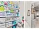 Walk-in pantry with neatly organized shelves stocked with household essentials and cleaning supplies at 2672 Painted Mist Ct, Las Vegas, NV 89142