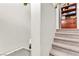 Carpeted stairs with white walls and decorative shelf at 2672 Painted Mist Ct, Las Vegas, NV 89142