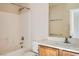 Bathroom with a bathtub, toilet and wooden sink vanity at 2728 Holmfault St, Henderson, NV 89044
