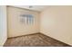 Bedroom featuring neutral walls, carpet floors, and a window at 2728 Holmfault St, Henderson, NV 89044
