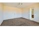Inviting bedroom with carpet, access to bathroom, and neutral walls, ready for personal touches at 2728 Holmfault St, Henderson, NV 89044