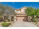 Charming home featuring a two-car garage and drought-tolerant landscaping for easy maintenance at 2728 Holmfault St, Henderson, NV 89044