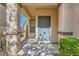 Inviting covered front porch with natural light and a security screen door at 2728 Holmfault St, Henderson, NV 89044