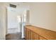 Hallway with carpet, wooden cabinet, and neutral color scheme at 2728 Holmfault St, Henderson, NV 89044