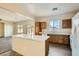 Bright kitchen with island, abundant cabinet space, and a seamless transition to the living area at 2728 Holmfault St, Henderson, NV 89044