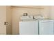 Laundry room with washer, dryer and shelving at 2728 Holmfault St, Henderson, NV 89044