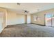 Spacious living room with carpet flooring, recessed lighting, and natural light at 2728 Holmfault St, Henderson, NV 89044