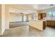 Bright living room featuring an open floor plan, tile flooring, and a view to the living area at 2728 Holmfault St, Henderson, NV 89044