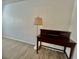 Bright bedroom featuring modern floors, a dark wood desk, and a decorative floor lamp at 3151 Soaring Gulls Dr # 1023, Las Vegas, NV 89128