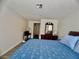 Well-lit bedroom with a bed, desk, and large mirror at 3151 Soaring Gulls Dr # 1023, Las Vegas, NV 89128