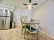 Bright dining area with a stylish ceiling fan and plenty of natural light at 3151 Soaring Gulls Dr # 1023, Las Vegas, NV 89128