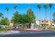 Community entrance with lush landscaping, mature trees, and clear signage in a well maintained neighborhood at 3151 Soaring Gulls Dr # 1023, Las Vegas, NV 89128