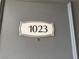 Apartment unit front door labeled '1023' with security lock at 3151 Soaring Gulls Dr # 1023, Las Vegas, NV 89128