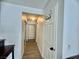 Hallway showing clean interior design, door with coat hooks, and shelving storage at 3151 Soaring Gulls Dr # 1023, Las Vegas, NV 89128