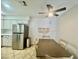 Eat-in kitchen with stainless steel refrigerator, neutral countertops, and a ceiling fan at 3151 Soaring Gulls Dr # 1023, Las Vegas, NV 89128
