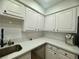 Updated kitchen with sleek countertops, stainless steel appliances, and ample cabinet space at 3151 Soaring Gulls Dr # 1023, Las Vegas, NV 89128