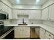 Updated kitchen featuring modern appliances, quartz countertops, and ample cabinet space at 3151 Soaring Gulls Dr # 1023, Las Vegas, NV 89128