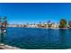 Beautiful lake view featuring waterfront homes, and boats in the distance on a clear, sunny day at 3151 Soaring Gulls Dr # 1023, Las Vegas, NV 89128