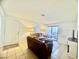 Inviting living room with neutral tile flooring and a sliding door leading to the patio at 3151 Soaring Gulls Dr # 1023, Las Vegas, NV 89128