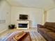 Cozy living room with an electric fireplace and plush seating, ideal for relaxation at 3151 Soaring Gulls Dr # 1023, Las Vegas, NV 89128