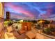 Relaxing outdoor balcony space with comfortable seating and stunning sunset views at 3165 Via Como, Henderson, NV 89044