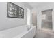 Serene bathroom with a freestanding tub and a separate glass-enclosed shower at 3165 Via Como, Henderson, NV 89044