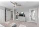 Bedroom featuring a ceiling fan, dresser with decor, and door to balcony at 3165 Via Como, Henderson, NV 89044