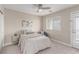 Bedroom featuring bed, side table, chair, and door to balcony at 3165 Via Como, Henderson, NV 89044