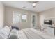 Bedroom featuring bed, study desk and chair, and door to balcony at 3165 Via Como, Henderson, NV 89044