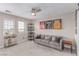 Bright bonus room with sofa, sports memorabilia, and neutral tones at 3165 Via Como, Henderson, NV 89044
