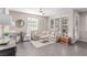 Inviting living room featuring a comfortable sectional sofa and stylish decor at 3165 Via Como, Henderson, NV 89044