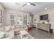 Neutral living room featuring modern decor, sectional sofa, and floor to ceiling windows at 3165 Via Como, Henderson, NV 89044