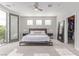 Serene main bedroom with plush carpeting, balcony access, and a walk-in closet at 3165 Via Como, Henderson, NV 89044