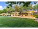 Inviting park area with covered picnic tables and well-maintained green lawns at 3165 Via Como, Henderson, NV 89044