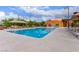 Sparkling community pool with lounge chairs for relaxation and fun in the sun at 3165 Via Como, Henderson, NV 89044