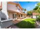 Charming backyard with a patio, built in grill, lush green lawn, mature trees providing shade and privacy at 3341 Heavenly View Ct, Las Vegas, NV 89117
