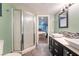 Bathroom with a double vanity, framed mirror and clear glass shower doors at 3341 Heavenly View Ct, Las Vegas, NV 89117