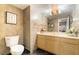 The bathroom features gold fixtures, a vanity with a cabinet, and dark tile floors at 3341 Heavenly View Ct, Las Vegas, NV 89117