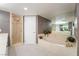 A bathroom featuring a bathtub and glass door shower with tile flooring at 3341 Heavenly View Ct, Las Vegas, NV 89117