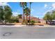 Charming home with mature trees, palm trees, and a long driveway leading to the attached two-car garage at 3341 Heavenly View Ct, Las Vegas, NV 89117