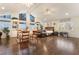 Expansive living area with vaulted ceilings, hardwood floors, built-in shelves, and multiple seating areas at 3341 Heavenly View Ct, Las Vegas, NV 89117