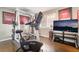 This home gym has a LifeCycle bike, weight set and television for fun workouts at 3341 Heavenly View Ct, Las Vegas, NV 89117