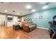 Living area showing bed, leather couch and full kitchen for in-law suite potential at 3341 Heavenly View Ct, Las Vegas, NV 89117