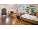 A living room with vaulted ceilings, built in shelves and hard wood flooring at 3341 Heavenly View Ct, Las Vegas, NV 89117