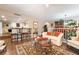 Open-concept living area with bar seating, comfortable sofa, and seamlessly connects to the dining area at 3341 Heavenly View Ct, Las Vegas, NV 89117