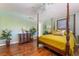 The main bedroom features a four-poster bed and beautiful dark wood floors at 3341 Heavenly View Ct, Las Vegas, NV 89117