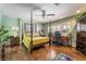 A comfortable main bedroom with a four-poster bed and lots of natural light at 3341 Heavenly View Ct, Las Vegas, NV 89117