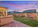 Charming backyard featuring manicured lawn, string lights, covered patio with BBQ island, ideal for relaxation at 352 Dandelion Brook Ct, Las Vegas, NV 89148